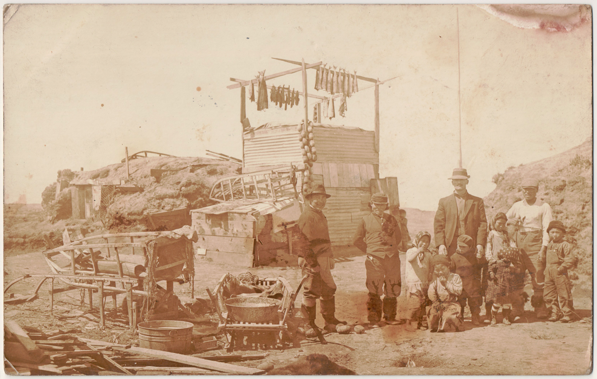 For sale: original 1916 postcard of Alaska Native
              family at their barabara near Naknek.