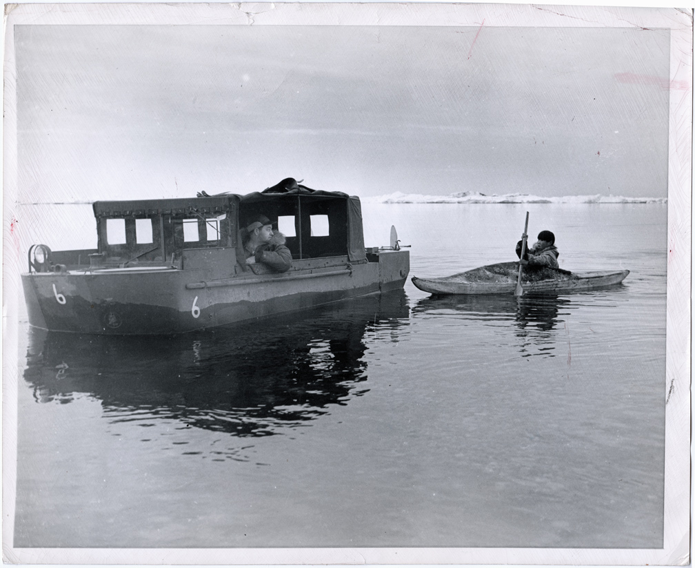For sale: An original 1945 press photo of a Seabee
                in a Weasel with an Inupiat Eskimo man in his Point
                Barrow Kayak.