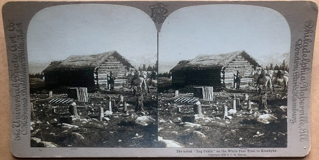 The noted "Log Cabin" on the White Pass
              Trail to Klondyke. Stereoview.