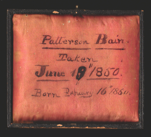 The identification of
                            Patterson Bain on the pillow of the
                            daguerreotype case lid.